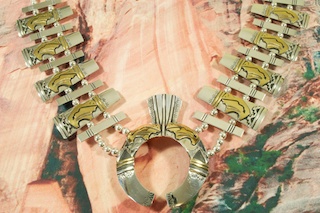 Stunning Sterling Silver Squash Blossom Necklace. Beautiful Buffalos with Heartline Design with 12K Goldfill. Created by Navajo Artist Tommy Singer.